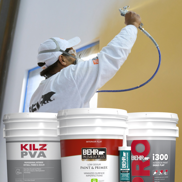 painter with 5 gal buckets of Behr & Kilz paint