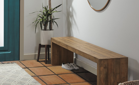 Stained bench in an entryway.