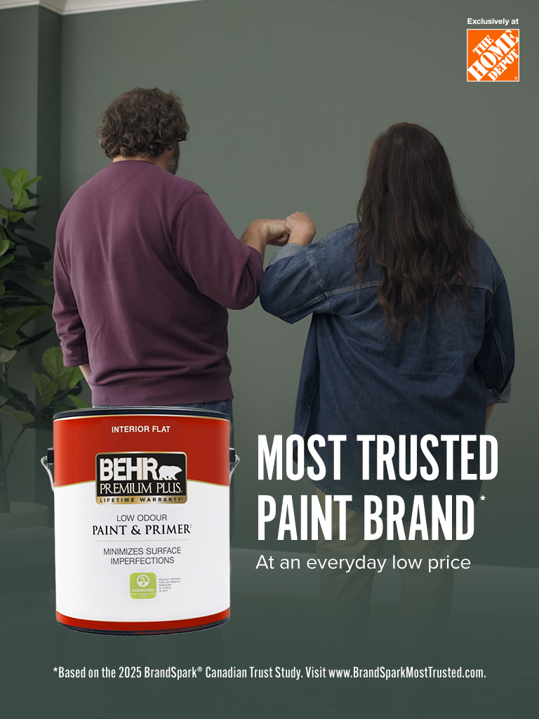 Mobile-sized image of a couple looking at their freshly painted wall
