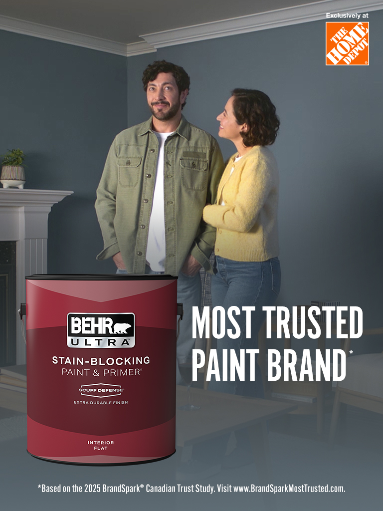 Mobile-sized image of a couple looking at their freshly painted wall