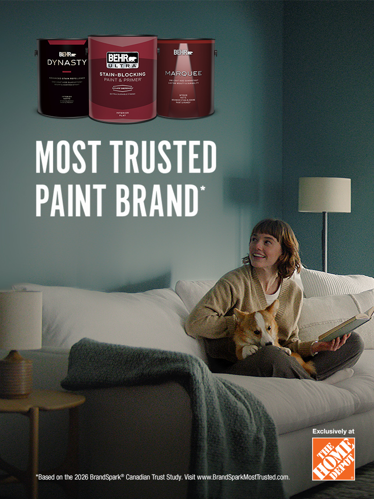 Mobile-sized image of a couple looking at their freshly painted wall