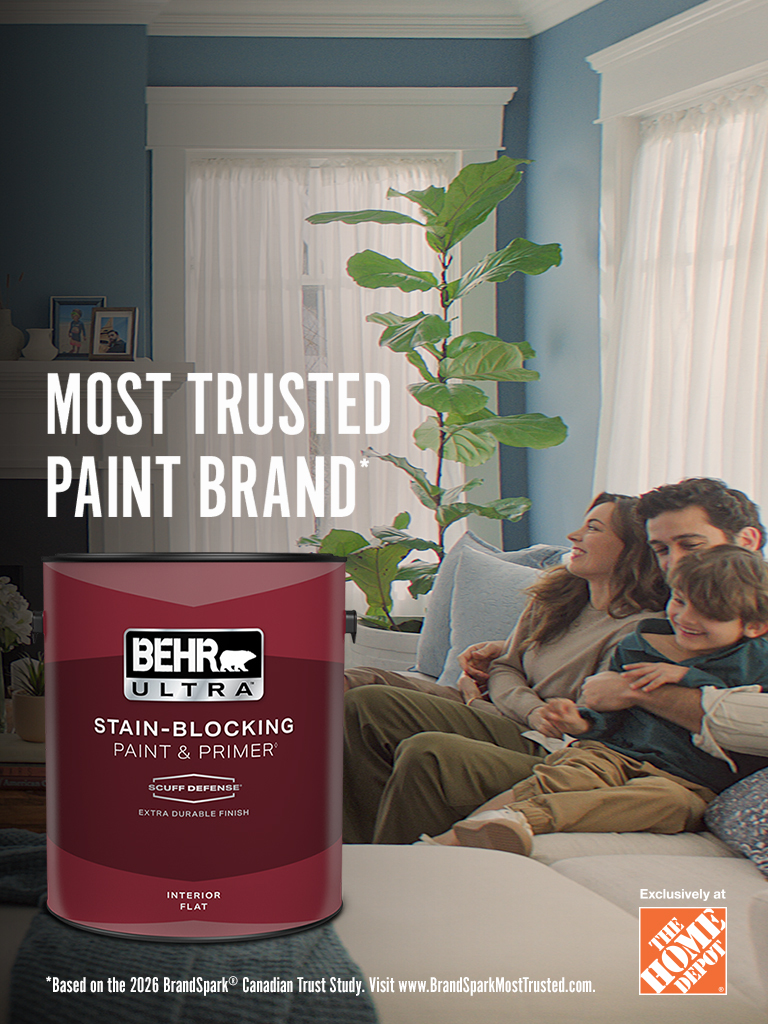 Mobile-sized image of a couple looking at their freshly painted wall