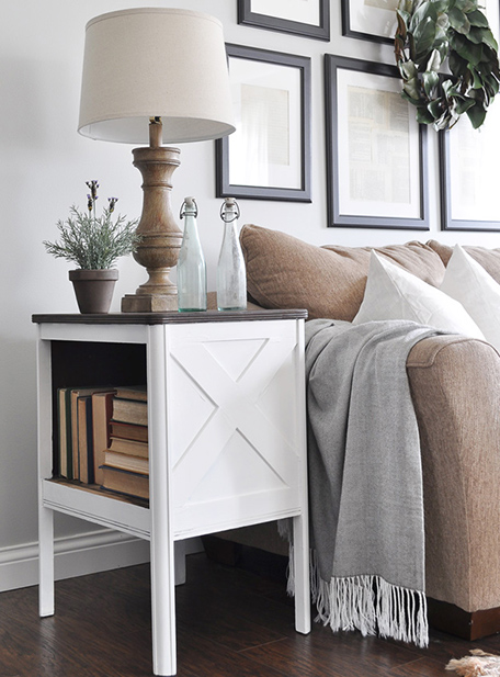 side table with lamp and decor next to sofa