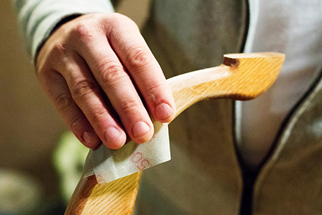 sanding leg of table by hand