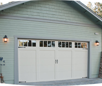 Green house with a white garage
