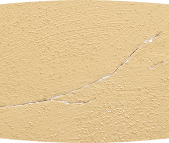 Cracked stucco wall close up