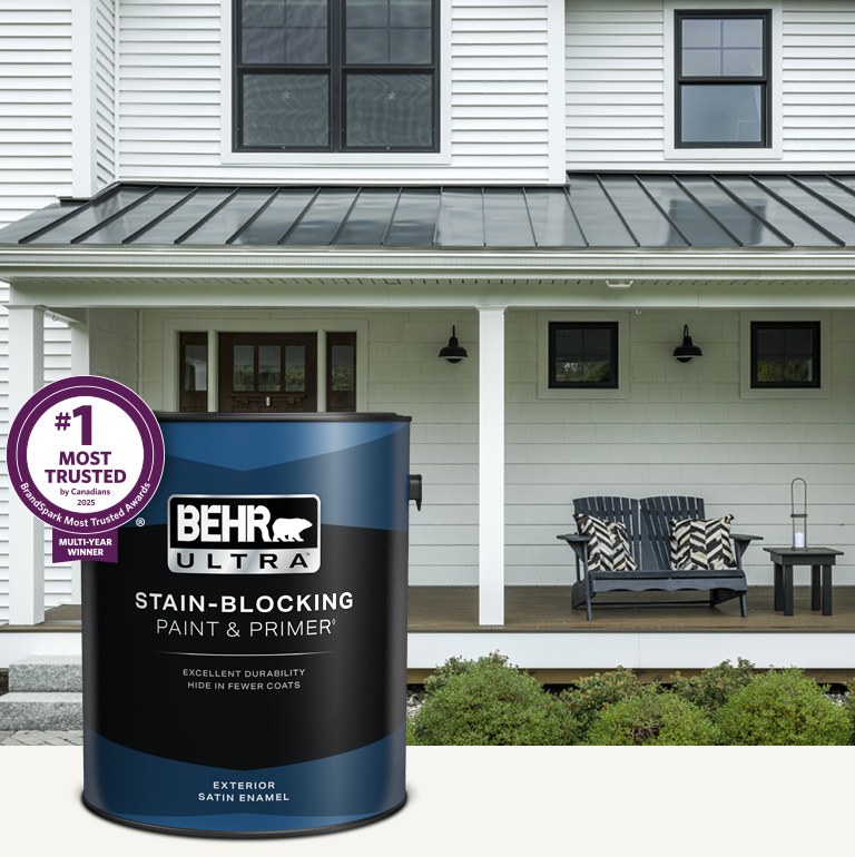 White house exterior with a can of Behr Ultra Exterior Satin Enamel in foreground Mobile