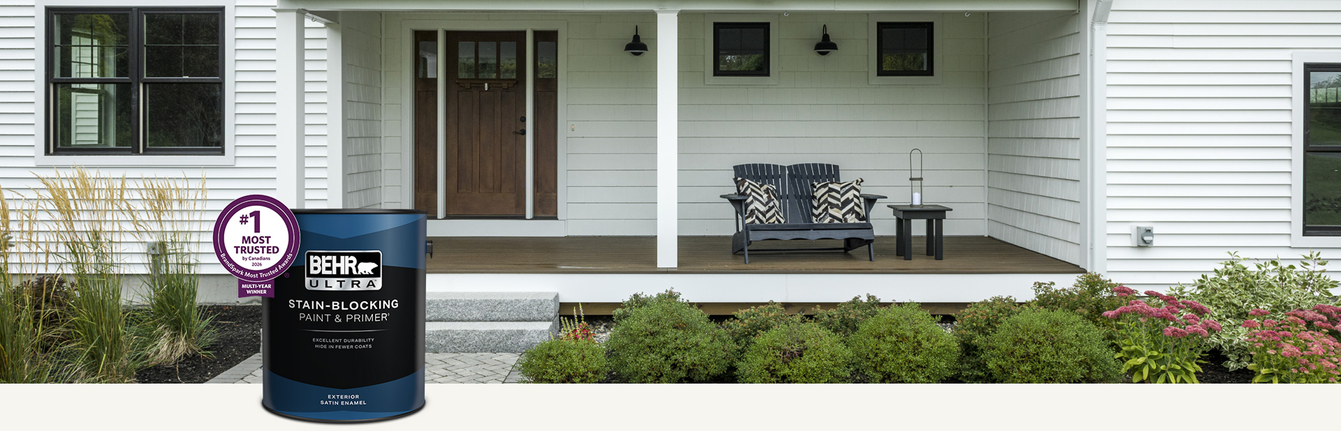 White house exterior with a can of Behr Ultra Exterior Satin Enamel in foreground