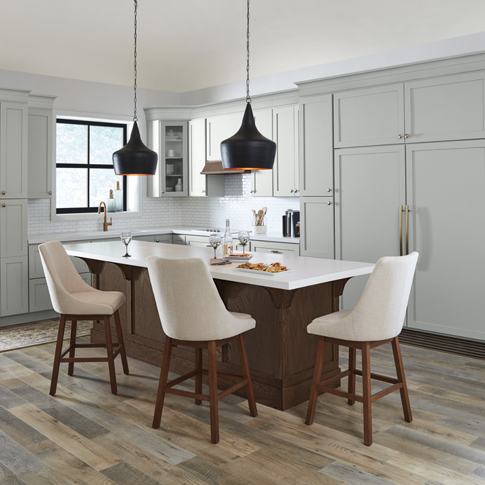 A grey and white kitchen painted with Behr Dynasty Interior paint