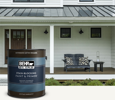 White house exterior with a can of Behr Ultra Exterior Satin Enamel in foreground Mobile