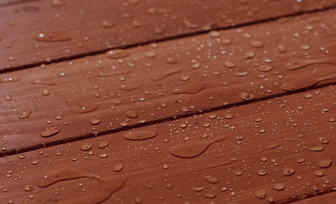 Stained deck with white water drops on it