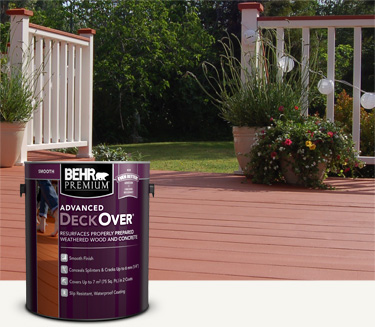 Two cans of Behr Premium Advanced DeckOver Coating with a wooden deck, product can, and brush in the background mobile