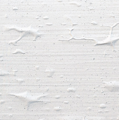 Close up image of a surface that is rough and has a crinkled painted surface.
