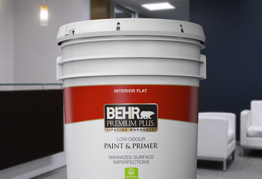 Image of a 5 gallon can shot of BEHR PREMIUM Plus Interior flat. The background is of a reception area.