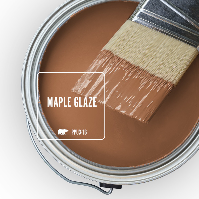 The top view of and open paint can with a half dipped paint brush, the paint color being featured is called Maple Glaze. 