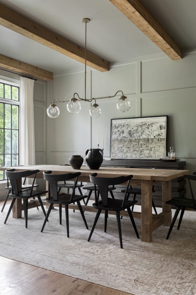 Lauren Lane's dining room painted in a warm grey with a warm green undertone.