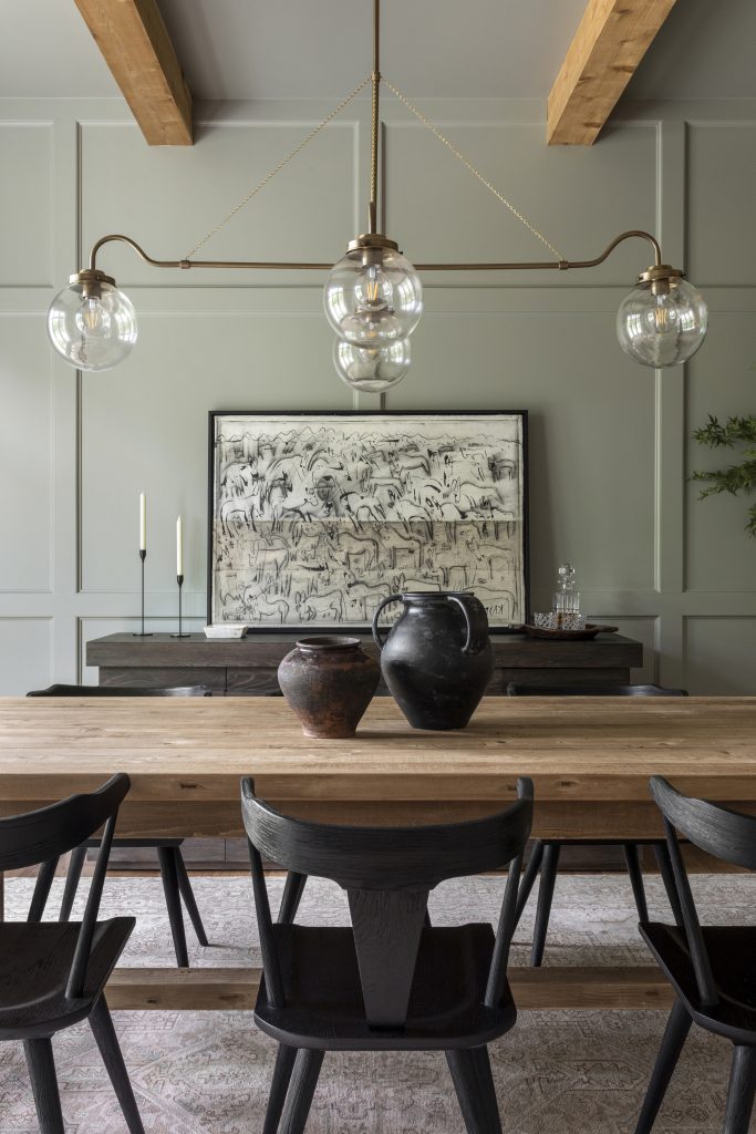 Lauren Lane's dining room painted in a warm grey with a warm green undertone.