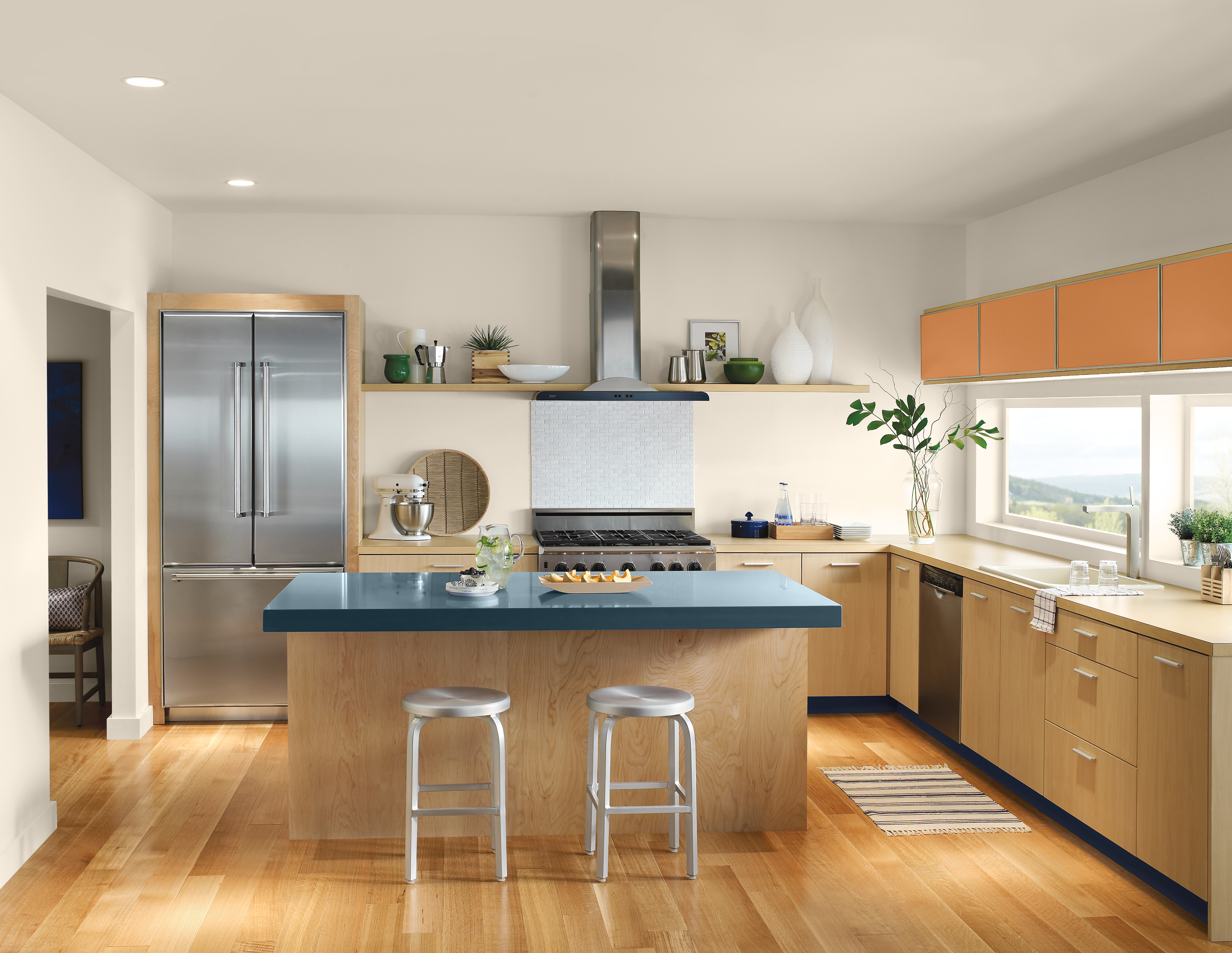 Retro-inspired kitchen with open shelving, and pops of colour on the kitchen island and cabinets