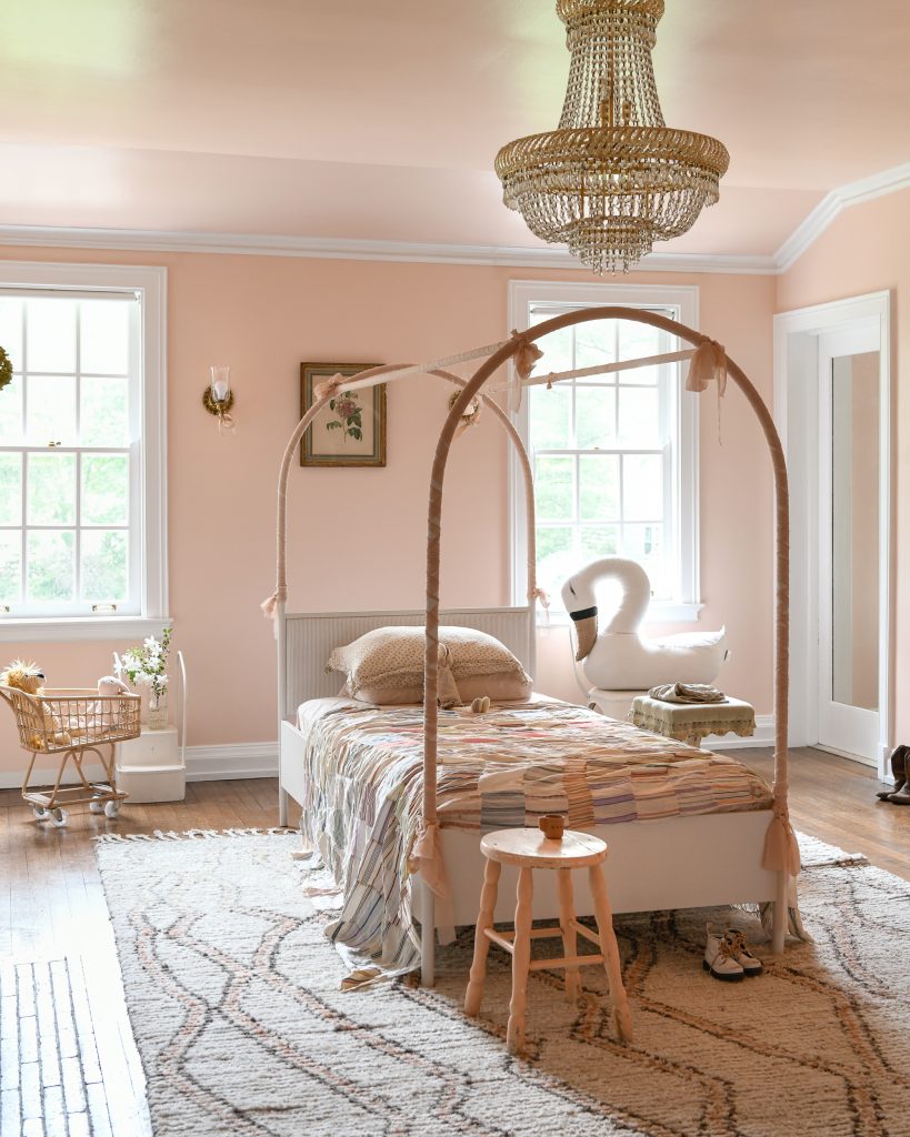 A bedroom painted in pink on both the walls and ceiling with colour coordinating furniture