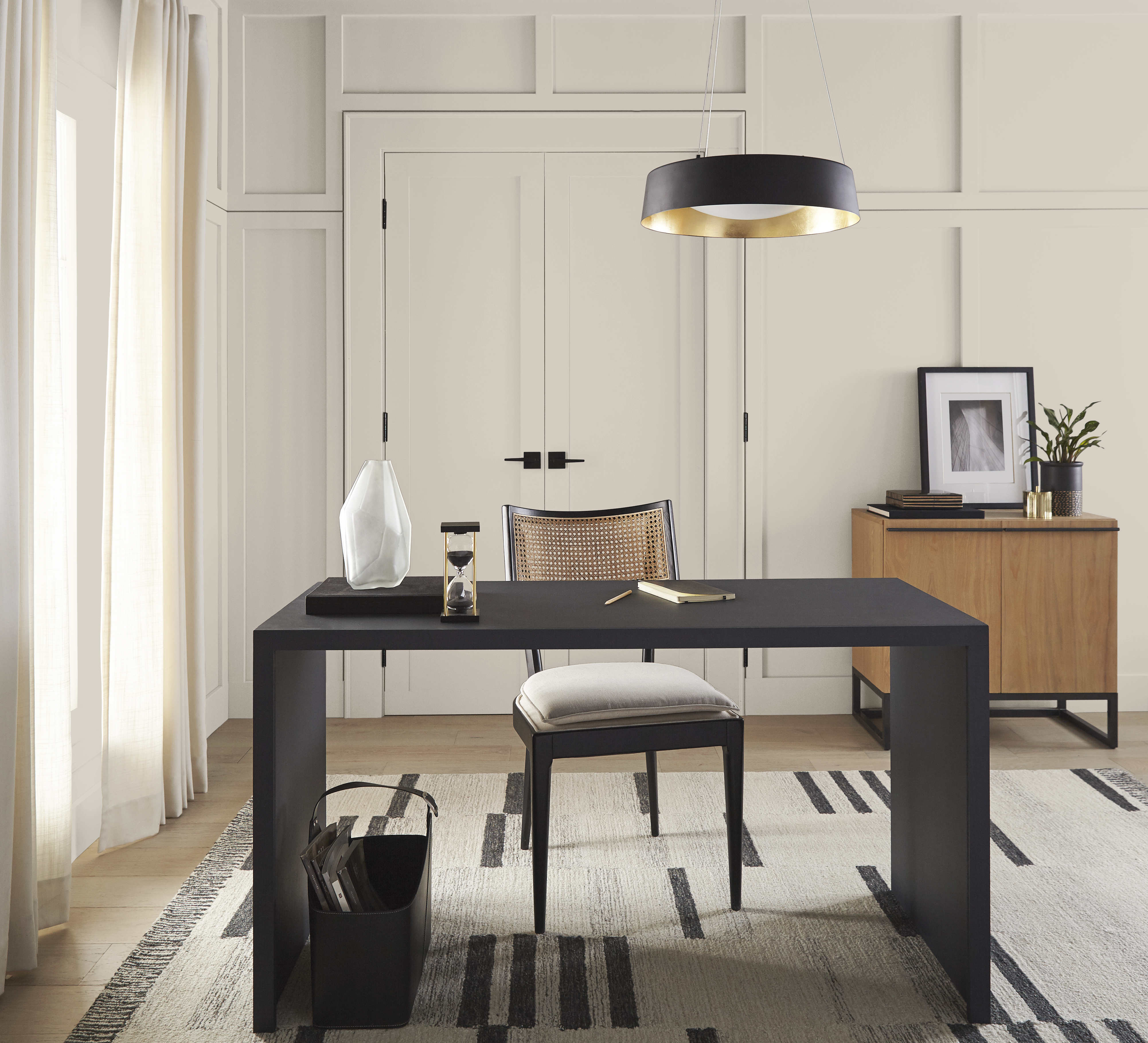 An elegant home office with walls and doors painted in Tranquil Gray