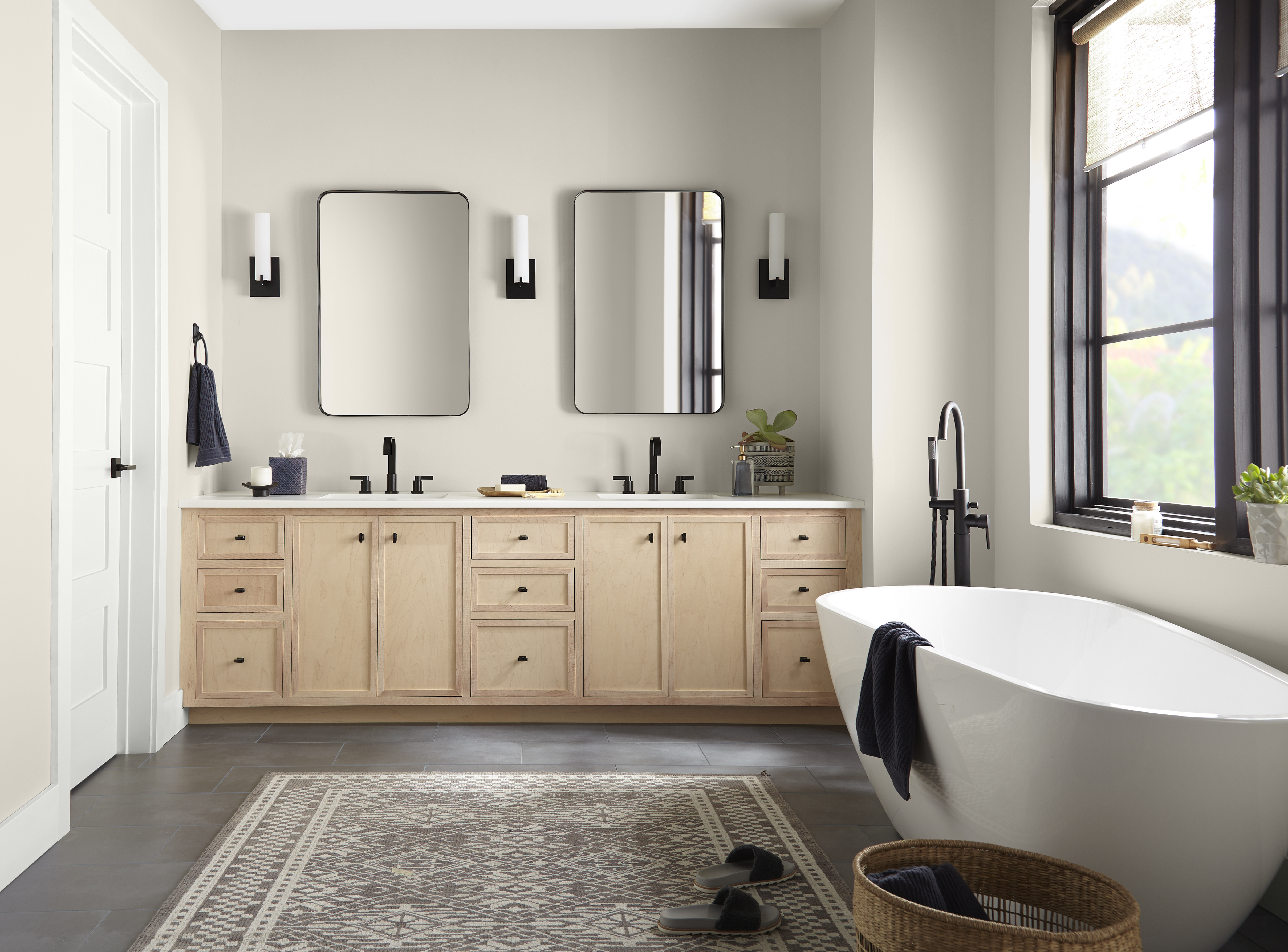 A light and airy bathroom with walls painted in a warm light greige colour