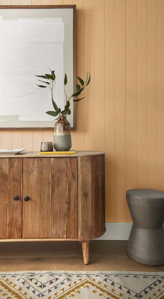 A hallway with walls painted in an orange hue