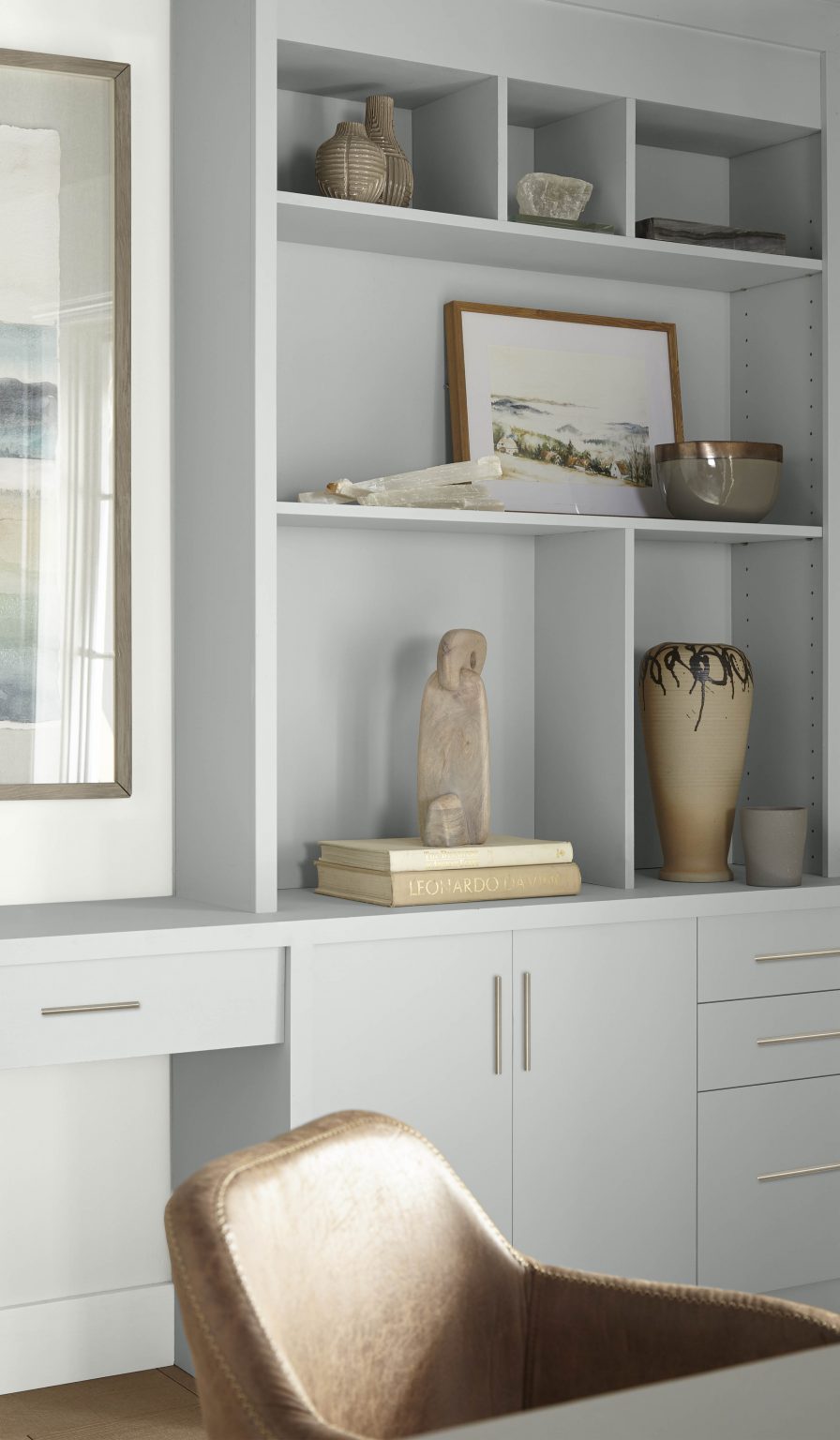 A built-in bookshelf painted in Platinum and surrounding walls in Ultra Pure White
