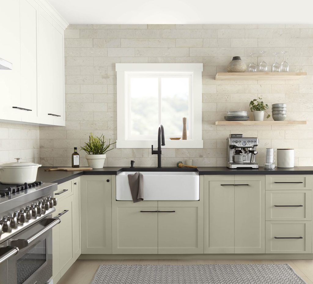 A bright and simple kitchen with lower cabinets in the colour Jungle Camouflage and open shelving 