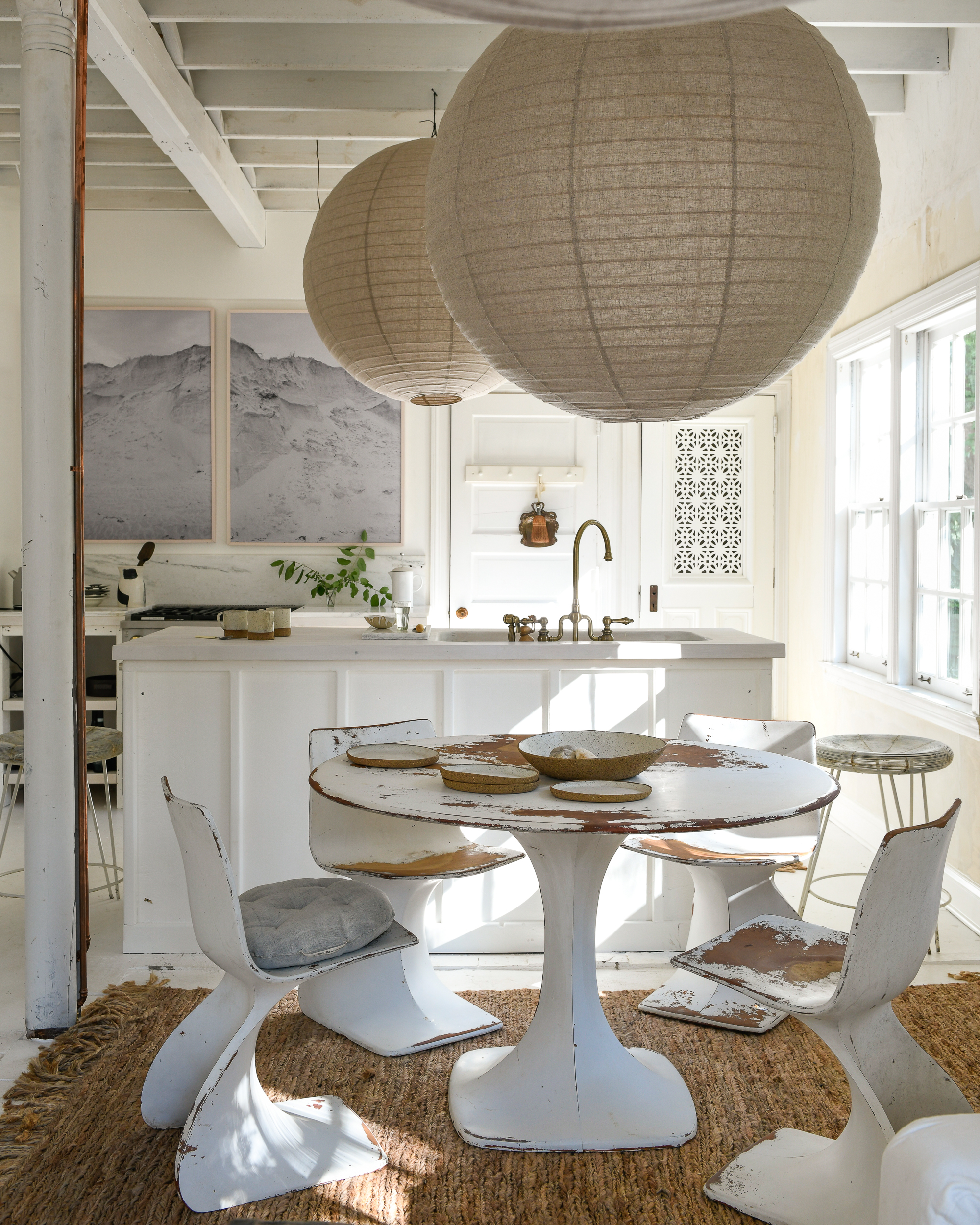 Leanne Ford’s dining area with walls painted in Natural White and styled with furniture and accents in neutral colours