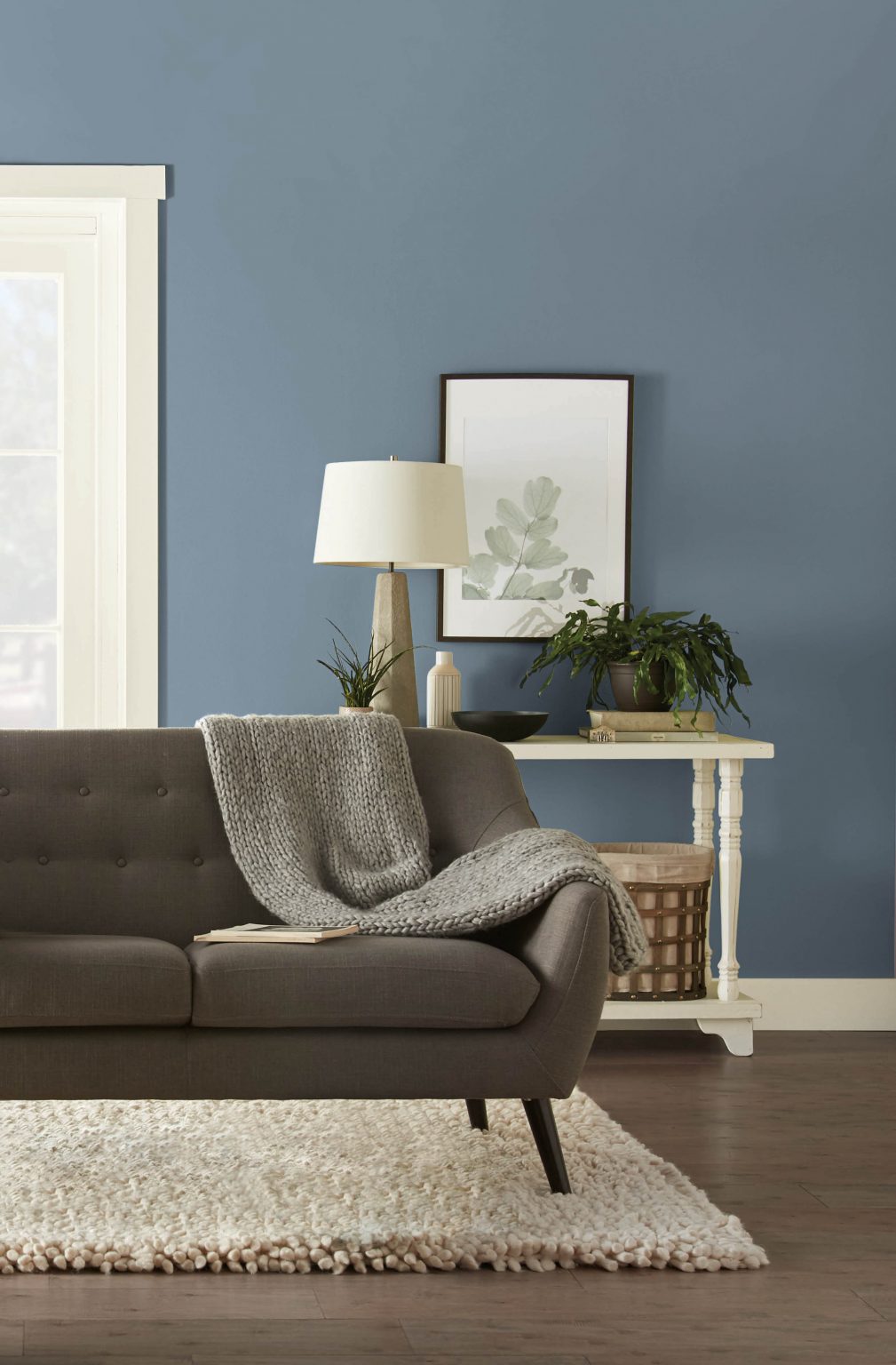 A simple living room with walls painted in Adirondack Blue