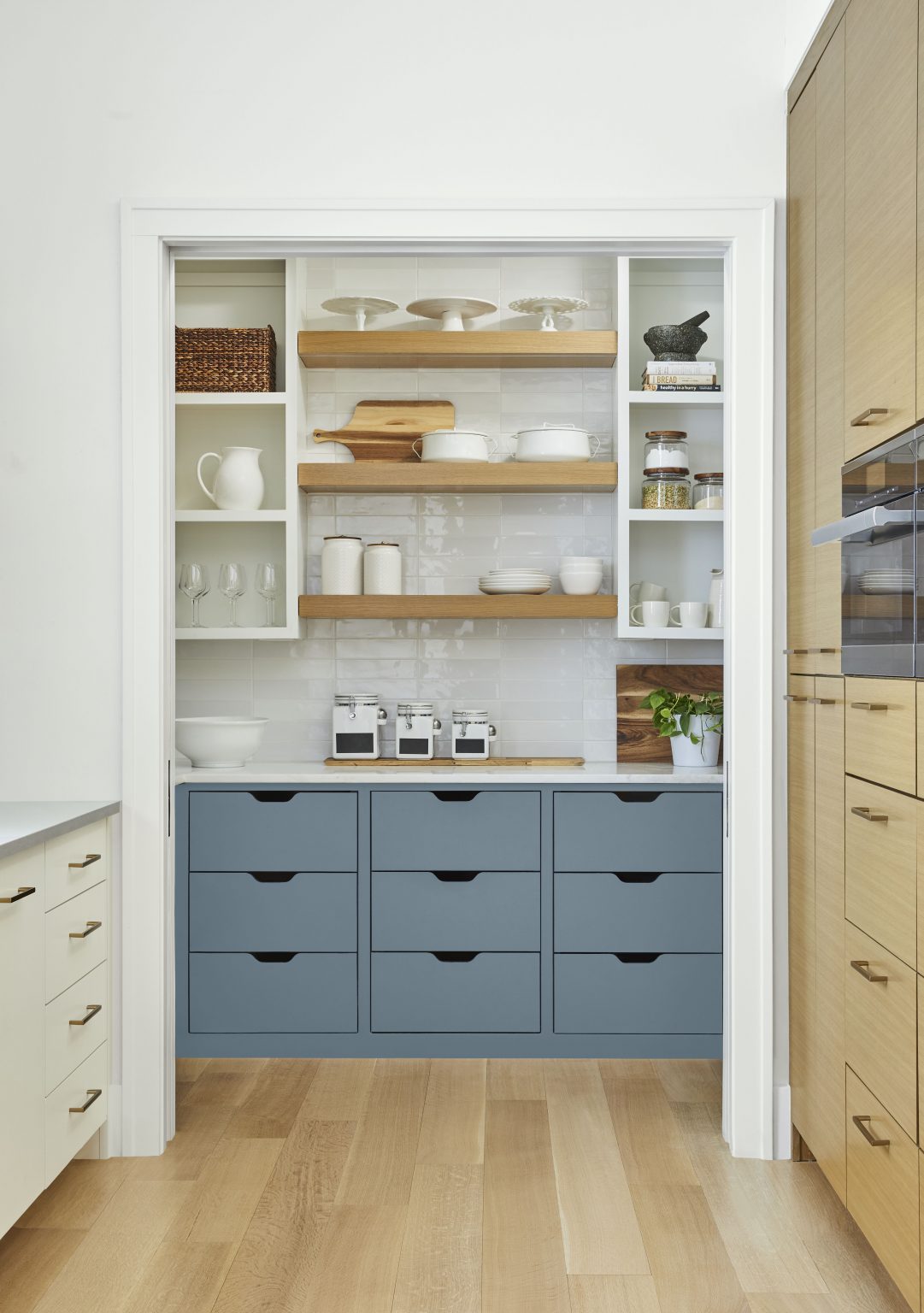 A casual kitchen with lower cabinets painted in Adirondack Blue