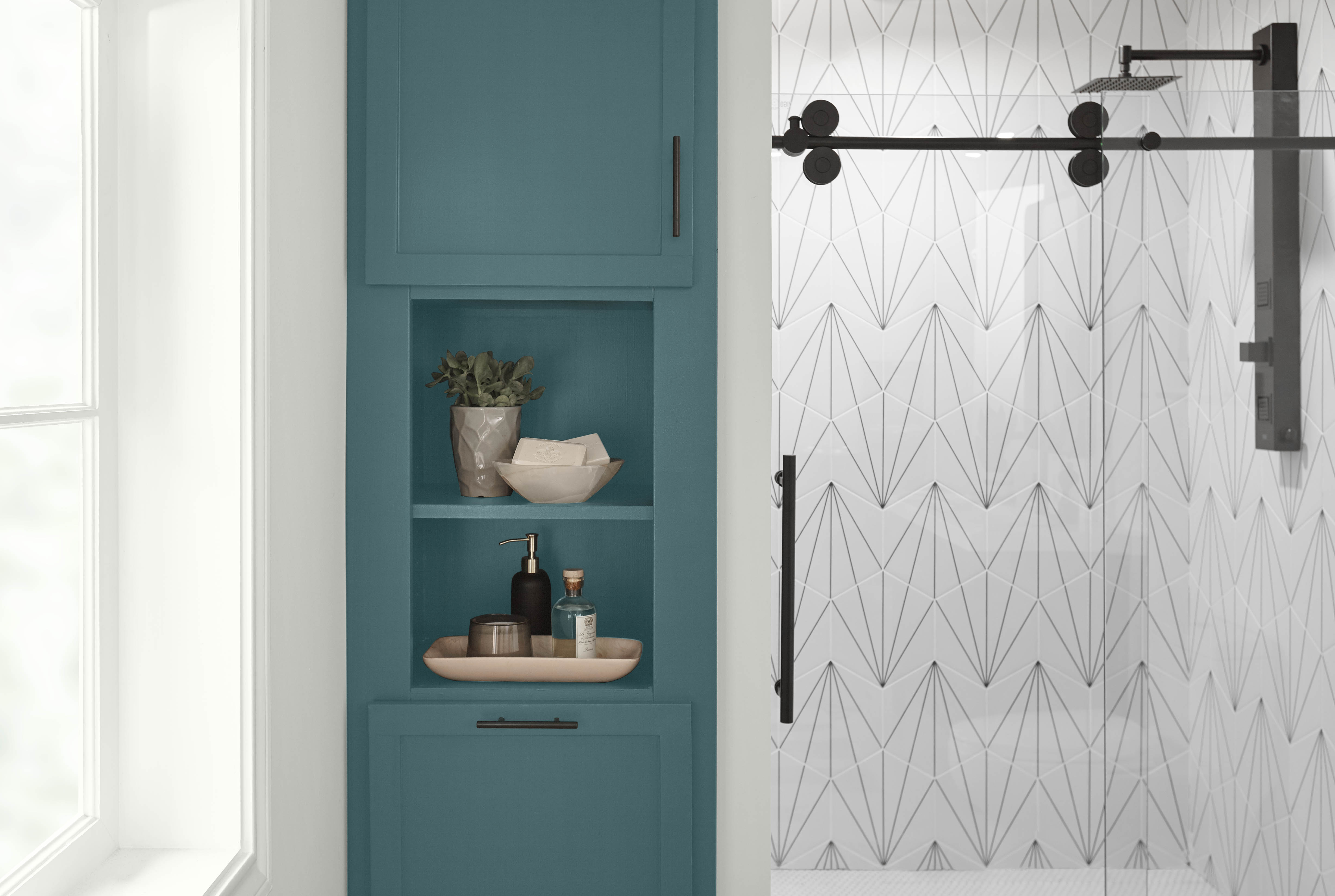 A modern bathroom with cabinetry in the colour Sophisticated Teal