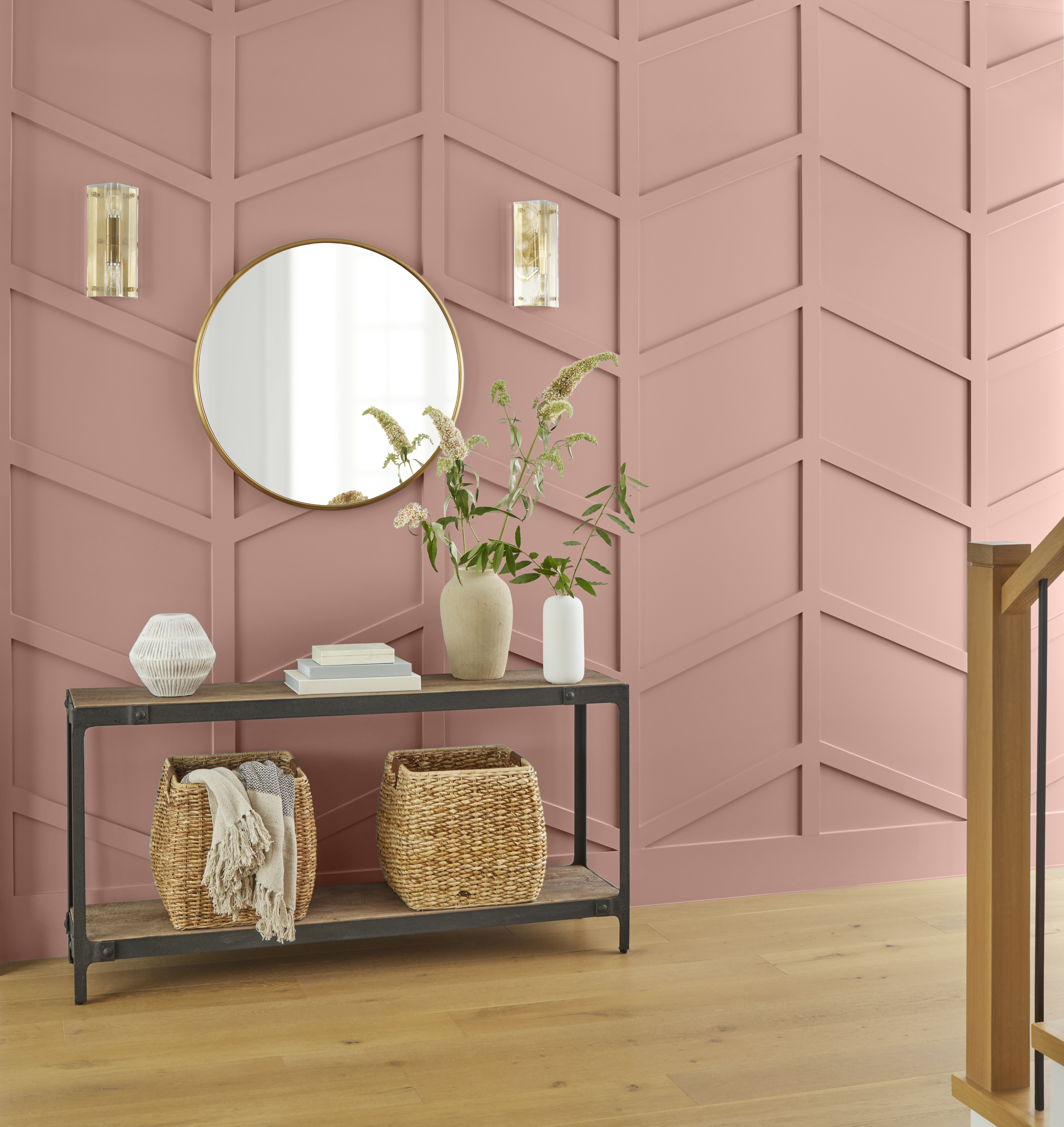 An accent wall in the colour Retro Pink styled with modern accessories 