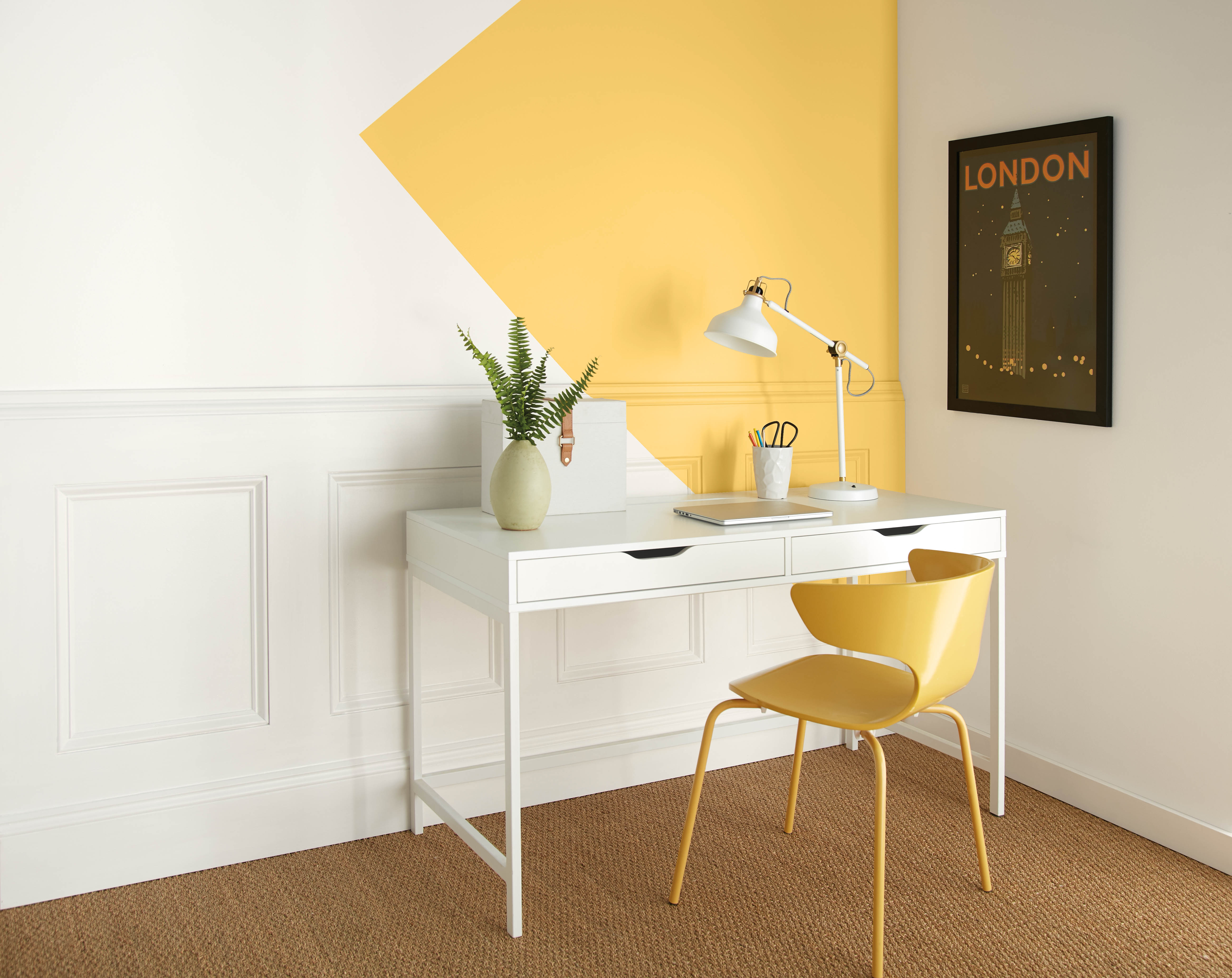 A bright home office with yellow accents