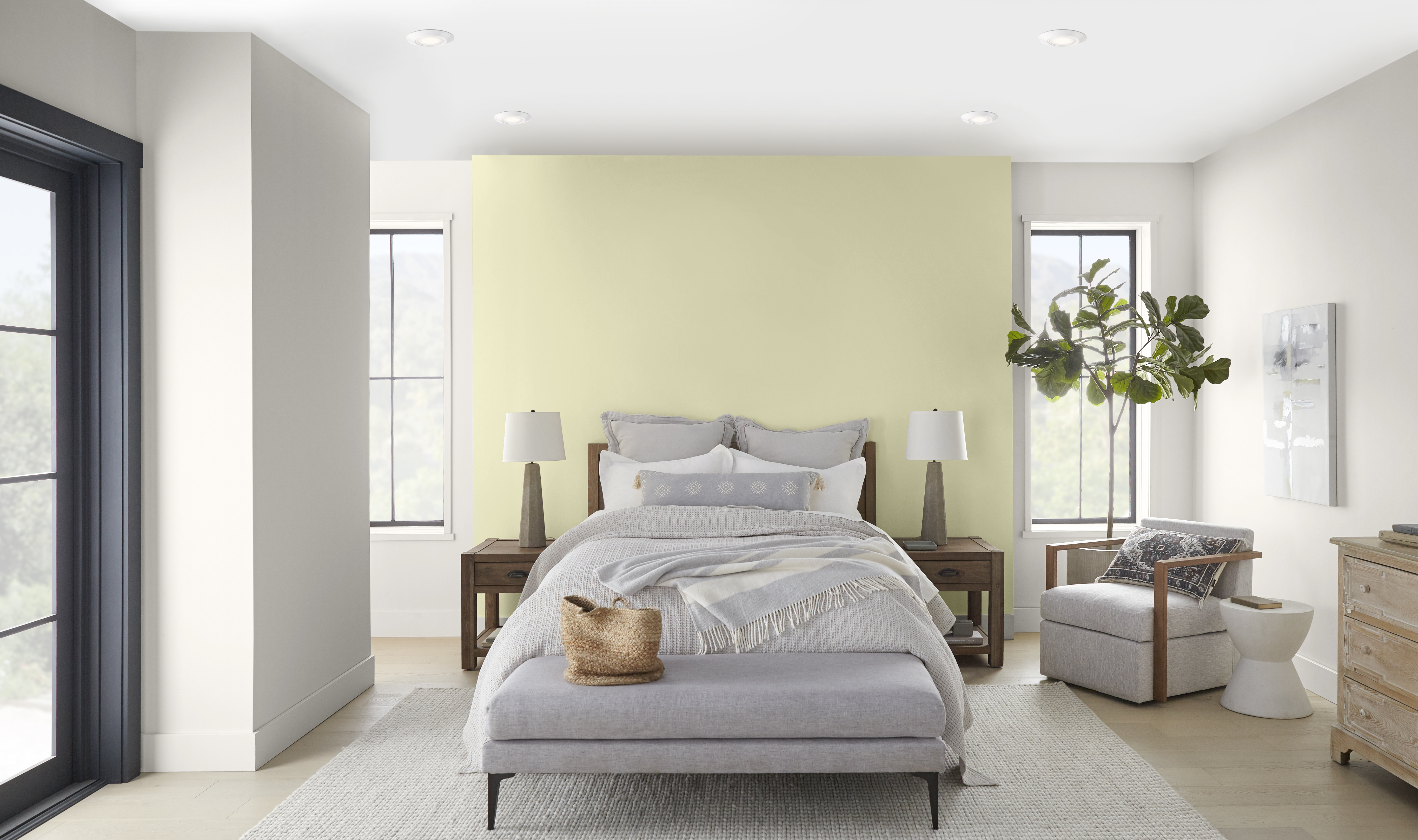 A bright and airy bedroom with an accent wall in the colour Hybrid behind the bed