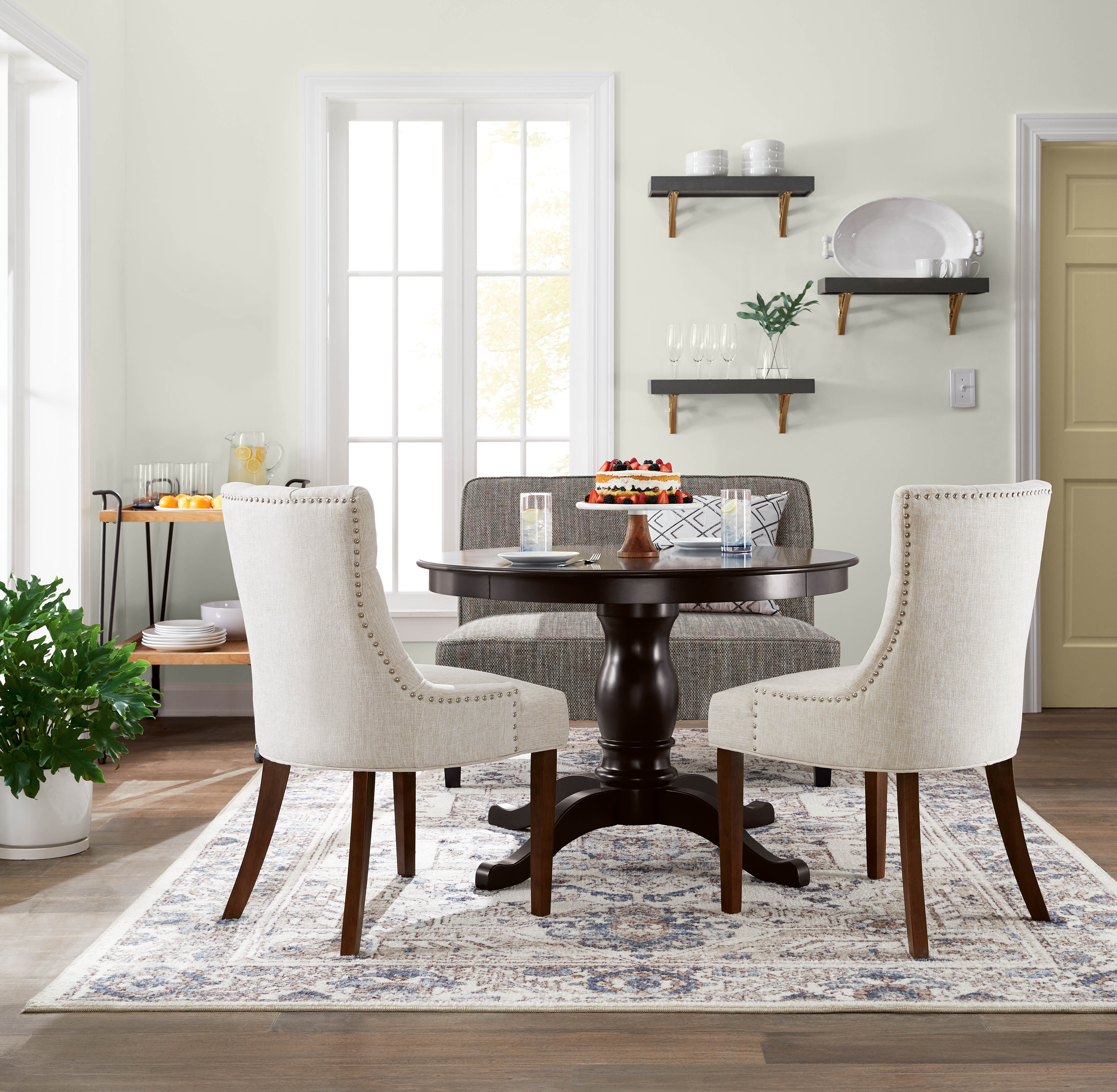 A bright and warm dining room with walls in the colour Silver Ash 