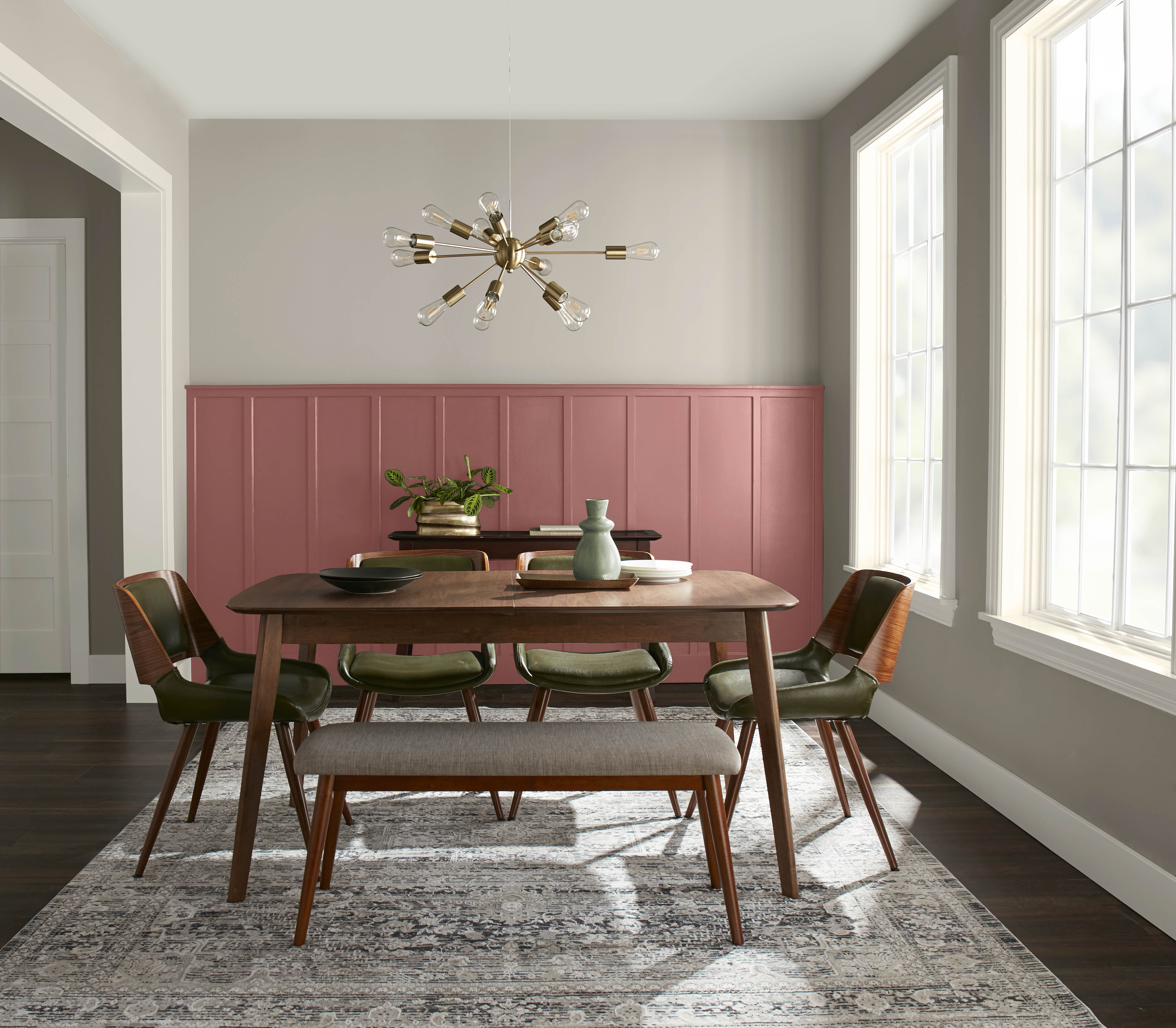 A dining room with upper walls in the colour Perfect Taupe and a board and batten lower wall in the colour Vermilion 