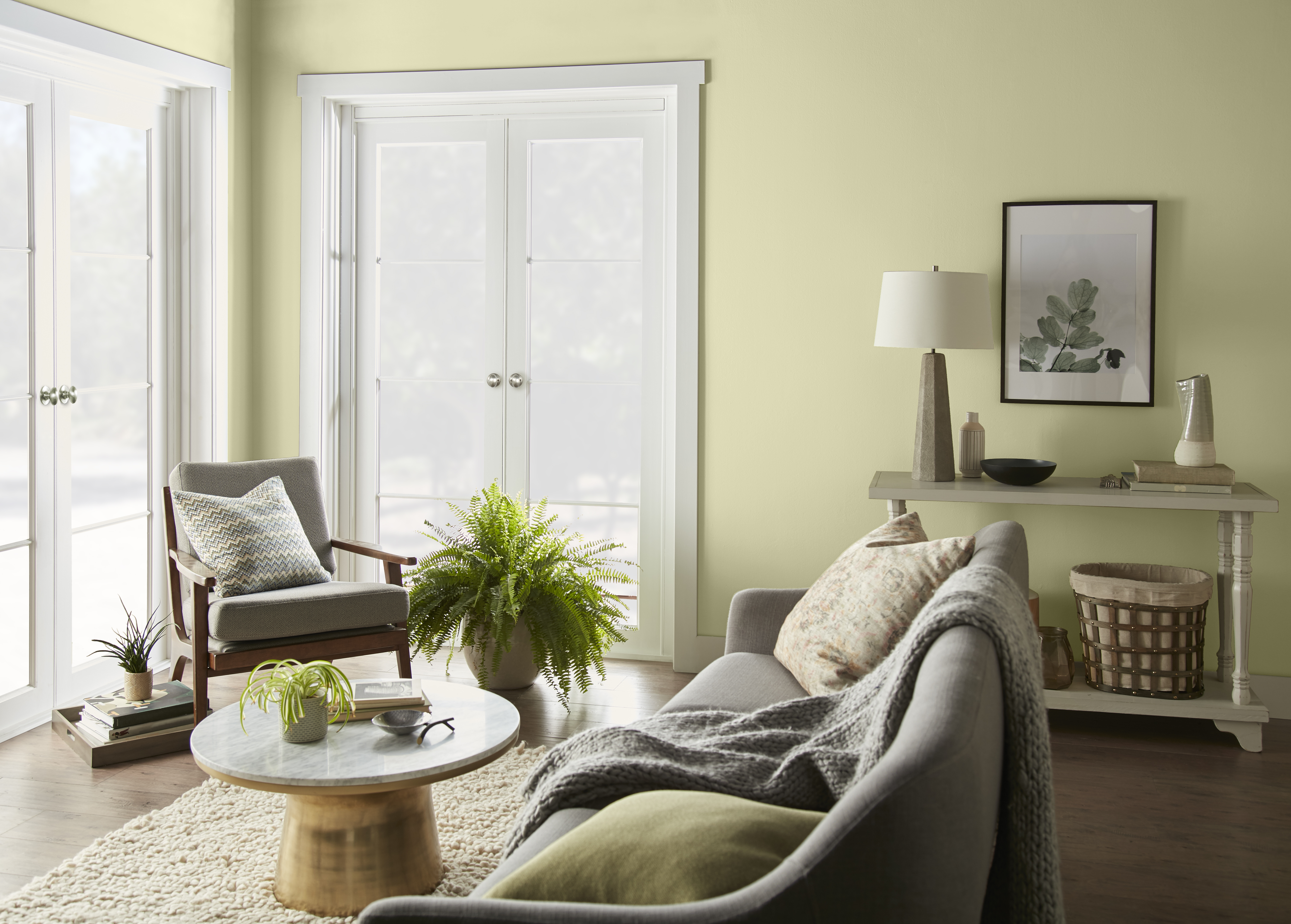 A bright casual living room with walls in the colour Hybrid