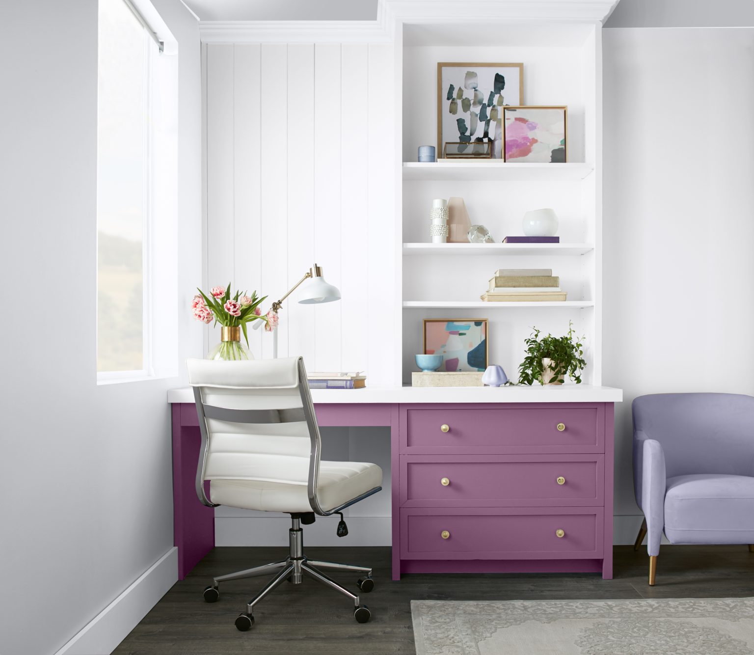 A home office with a desk in the colour Sophisticated Lilac and styled with soft pink and lavender décor and furniture