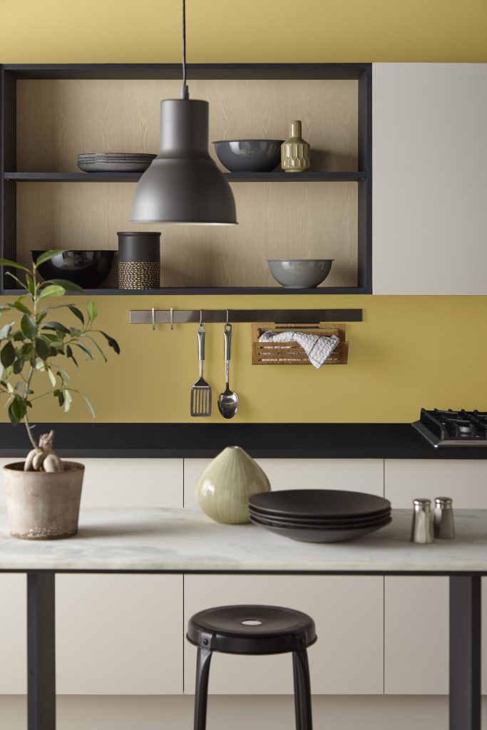 A modern kitchen space with walls painted in the colour Chilled Wine