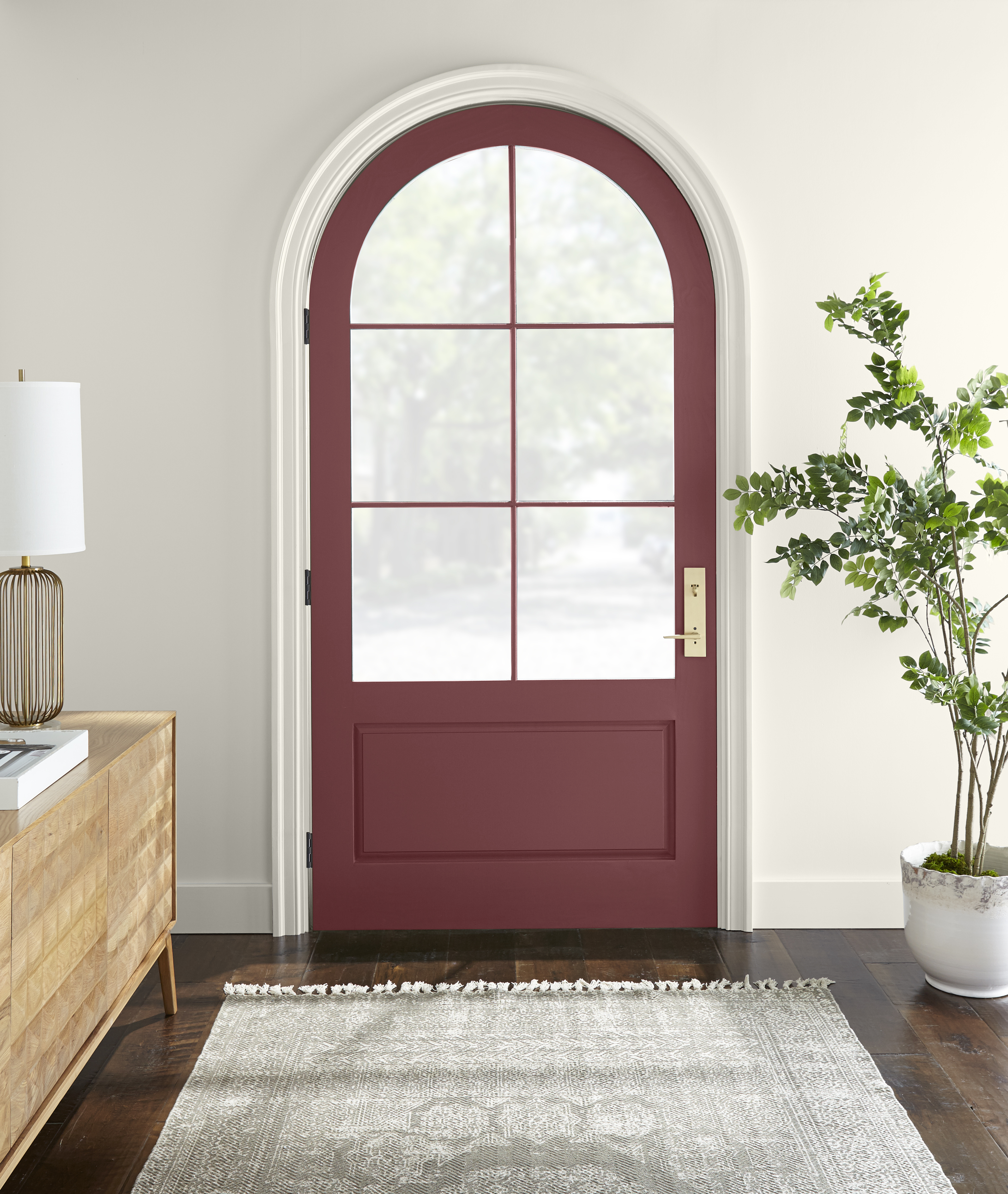 An arched front door in the colour Rumors