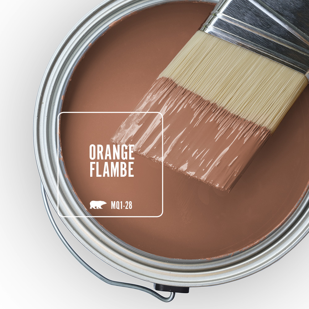 The top view of an open paint can featuring the colour Orange Flambe