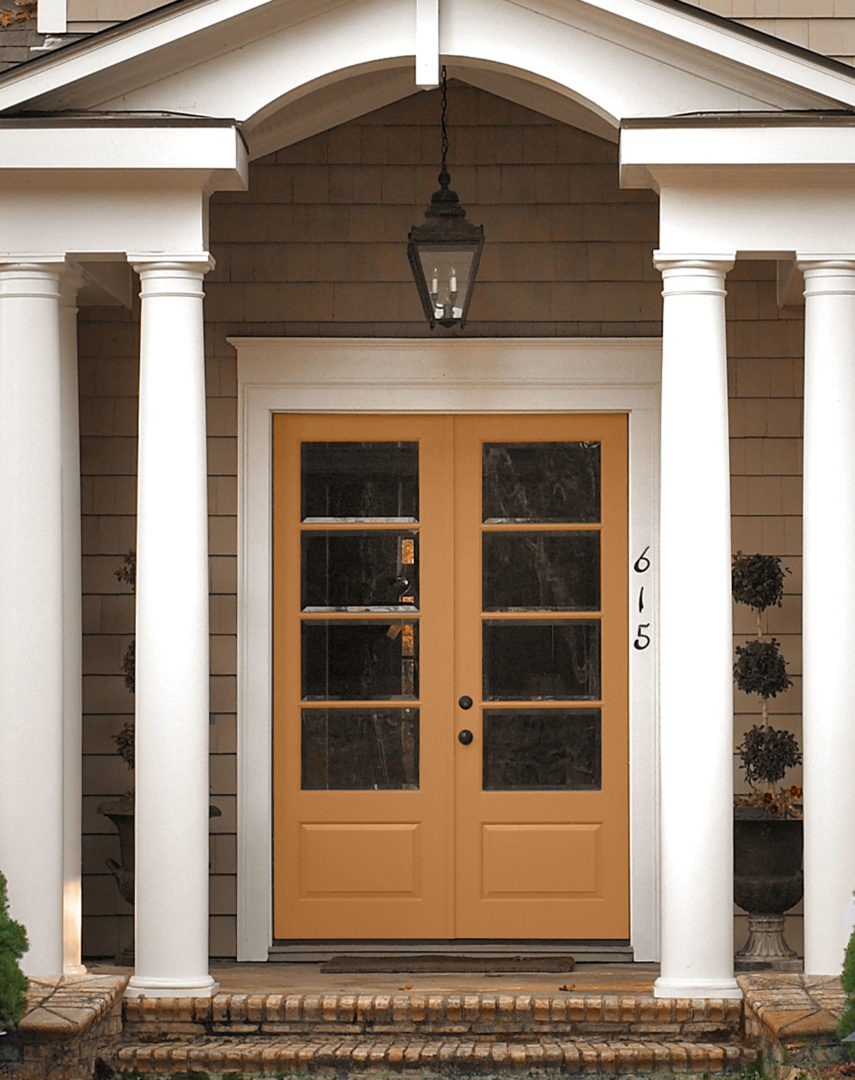 A closeup of the exterior of a home with a door in the colour Butter Rum