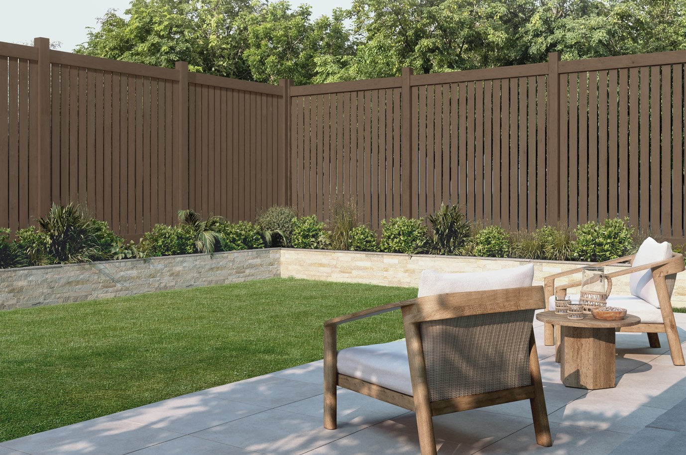 A brown solid colour wood fence in a backyard with two outdoor lounge chairs nearby