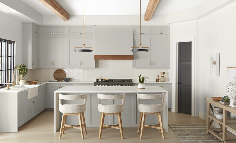 The image presents a beautifully designed modern kitchen with a warm and inviting atmosphere.