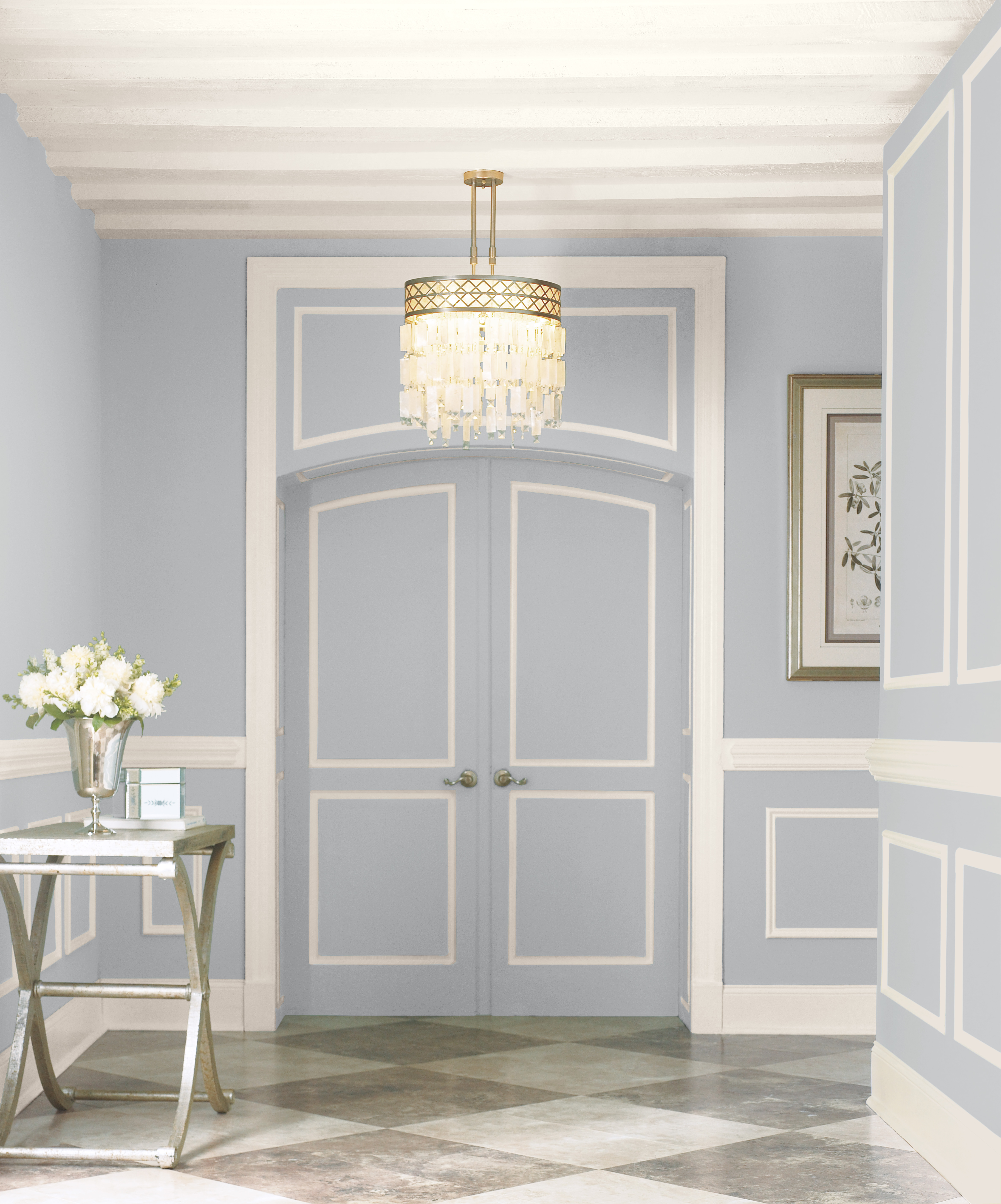 An entry with a quiet cool grey painted walls.