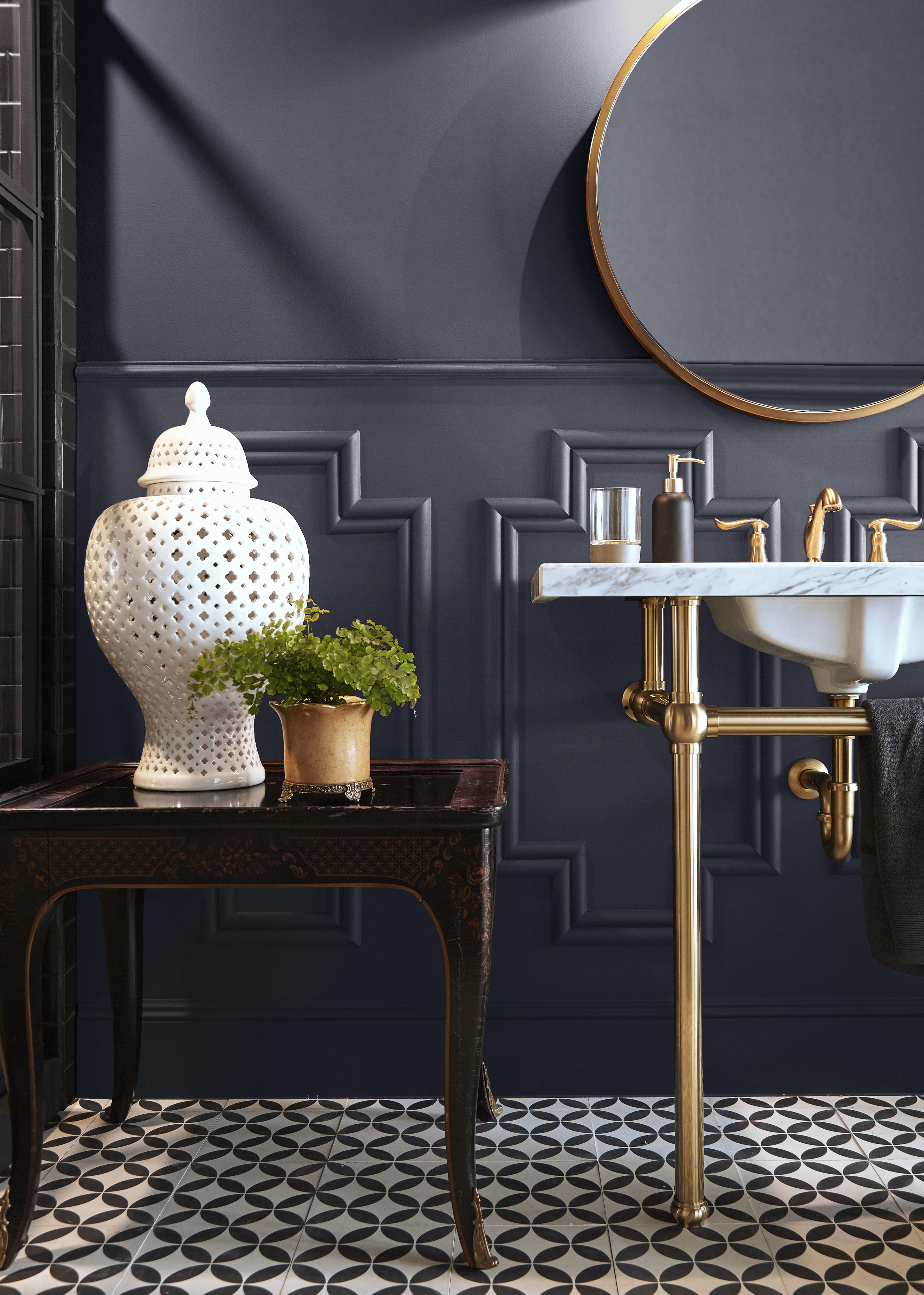 A bathroom painted in a dusted grey-black hue.
