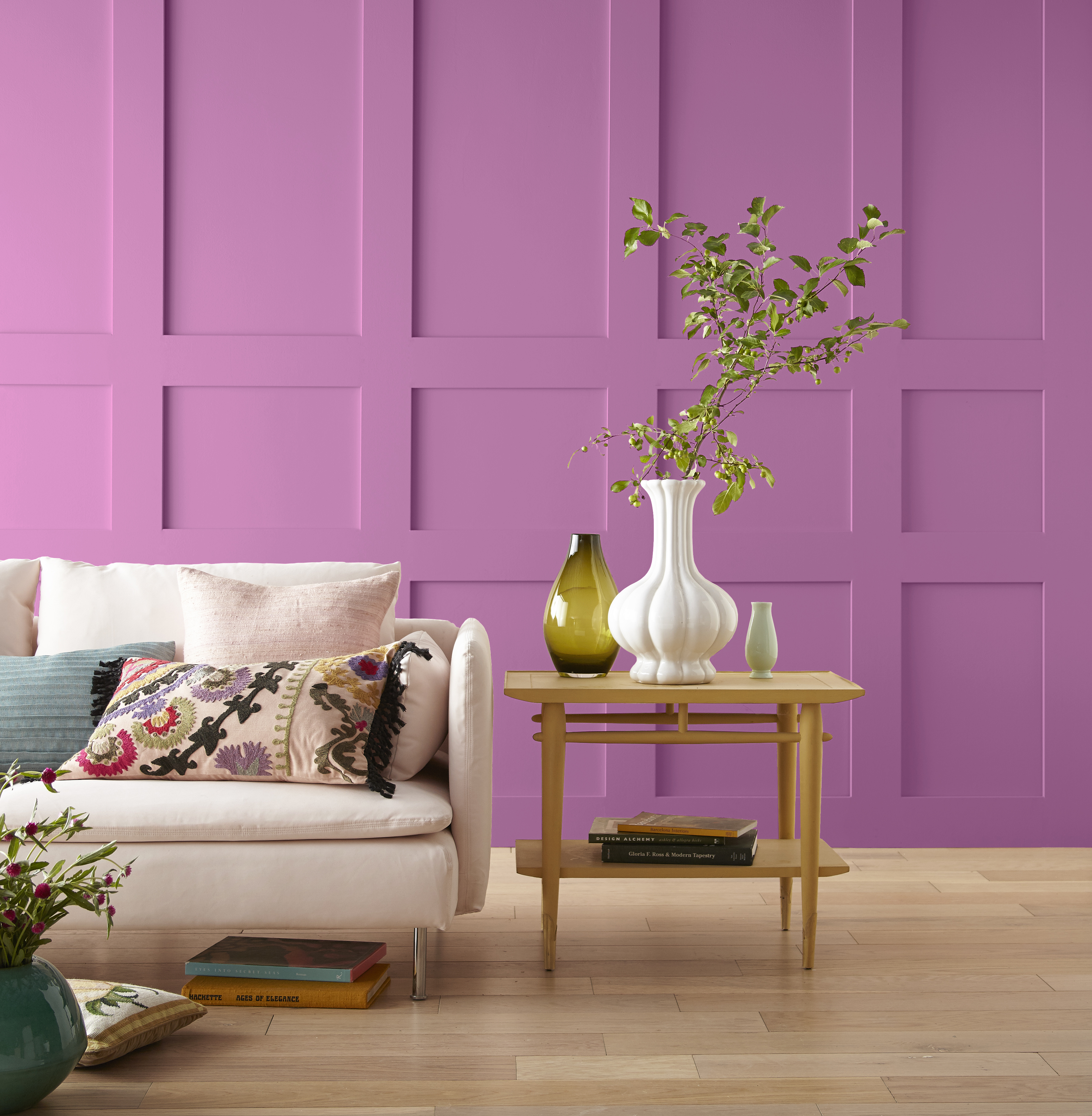 A living room with a bold magenta colour painted on the walls.