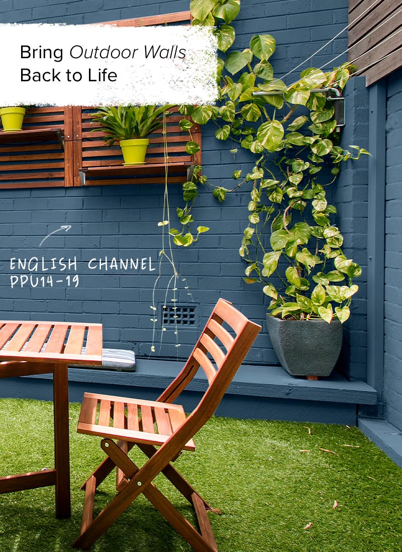 Outdoor eating area with walls painted in English Channel, Behr Marquee Exterior paint.