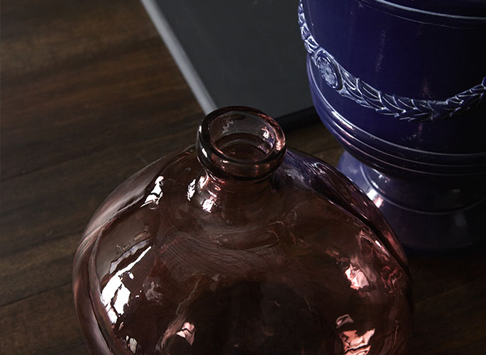 Tight crop of glass and ceramic jars.